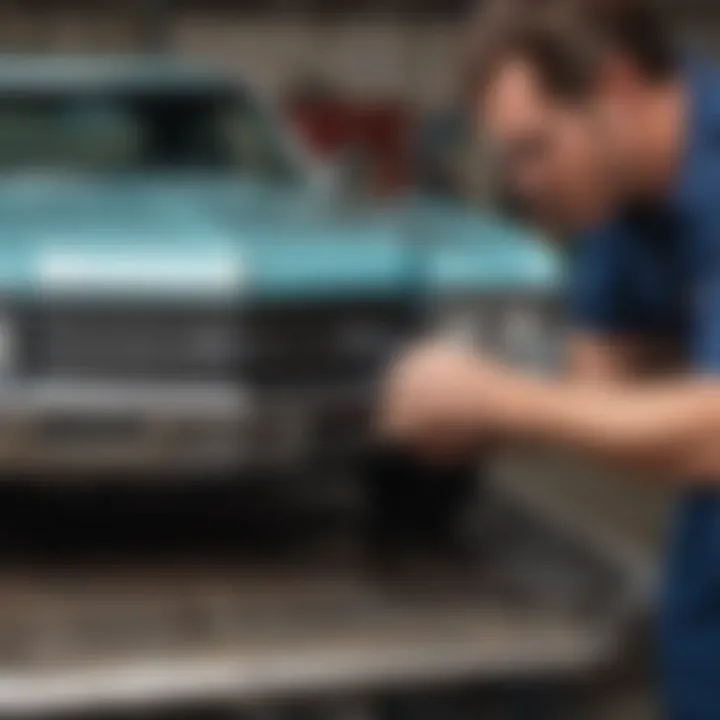 A technician performing a replacement of the wiper motor in a classic Chevelle.