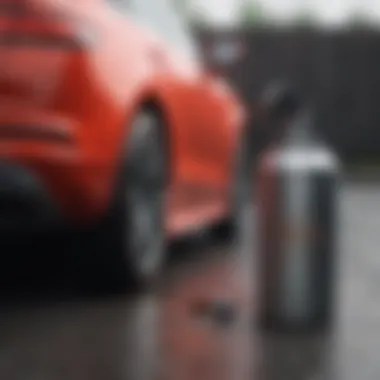 Demonstration of a rattle can being used to paint a car surface.