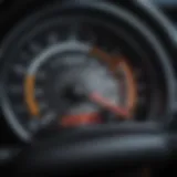 A close-up view of a car dashboard showcasing essential indicators.