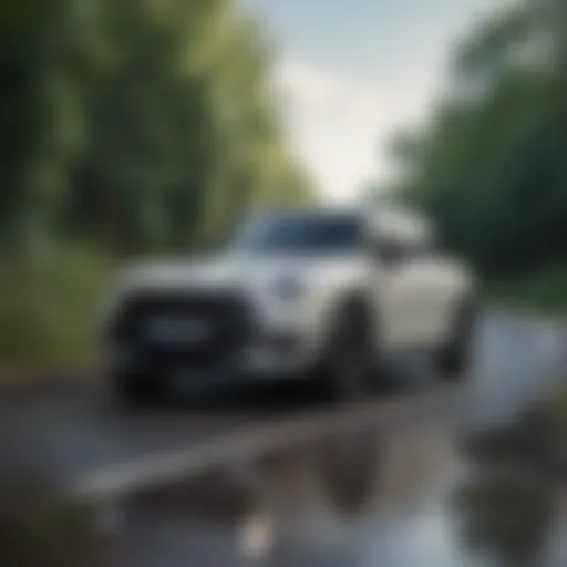 A sleek mini SUV parked on a scenic road, showcasing its compact design.