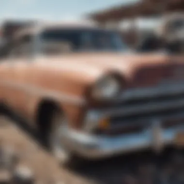 Close-up of a vintage car partially dismantled in a junkyard