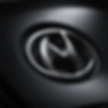 Detailed View of the Mazda Emblem Design Close-up view of the Mazda emblem showcasing its design details