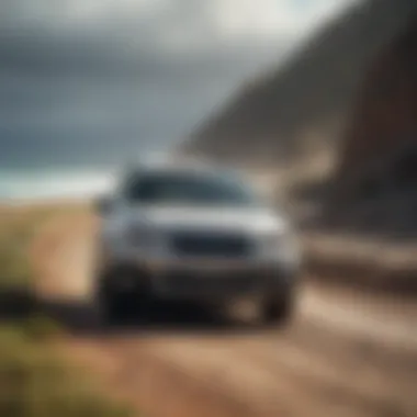 Subaru Outback driving on a scenic coastal road