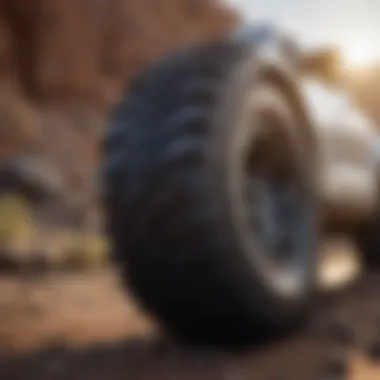 Close-up view of a high-performance tire for small SUVs on a rugged terrain.