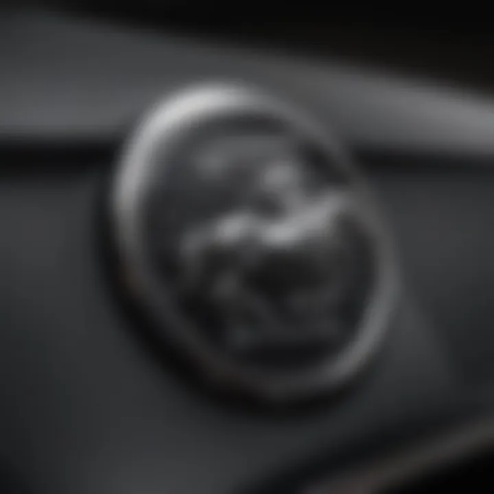 Close-up of the black Mustang's emblem highlighting its iconic status.