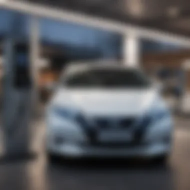 Nissan Leaf at Charging Station Nissan Leaf charging at a public station
