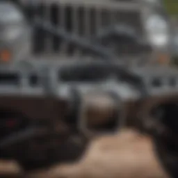 Close-up view of a Warn winch mounted on a Jeep JK